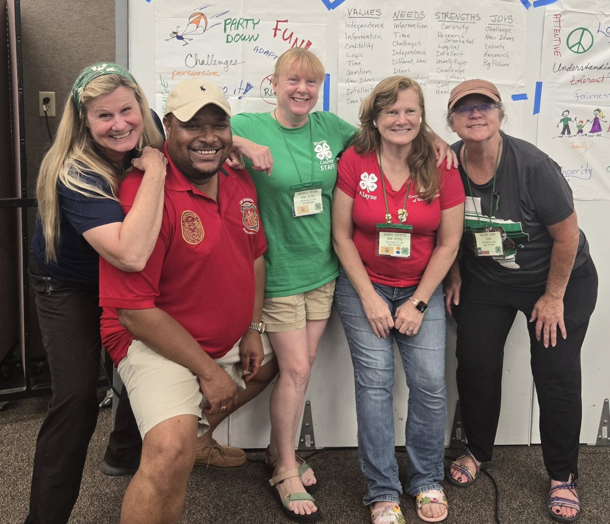 A group of diverse people hugging each other.